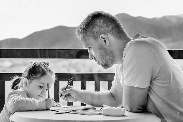 father-and-daughter-talking-over-papers