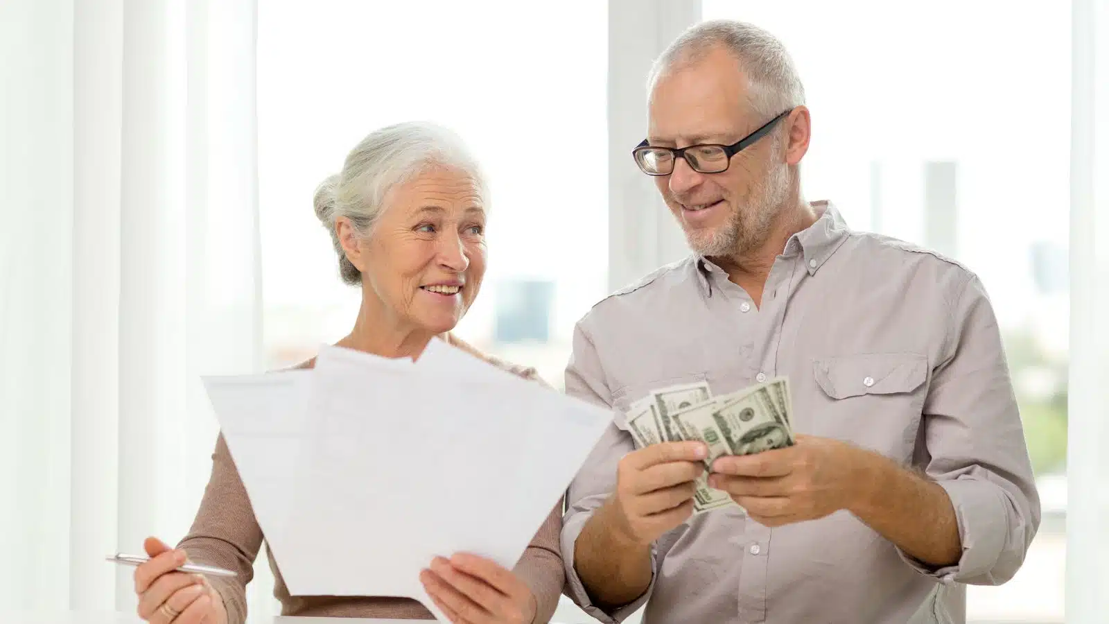older couple with money