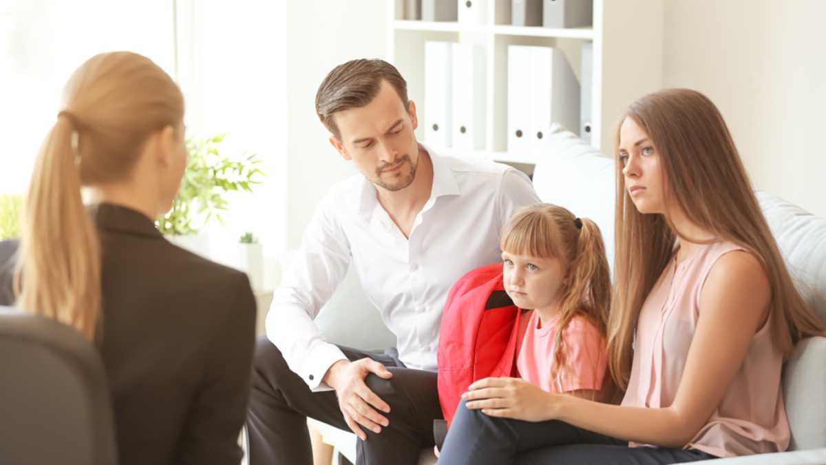 father meeting with teadher shutterstock MSN
