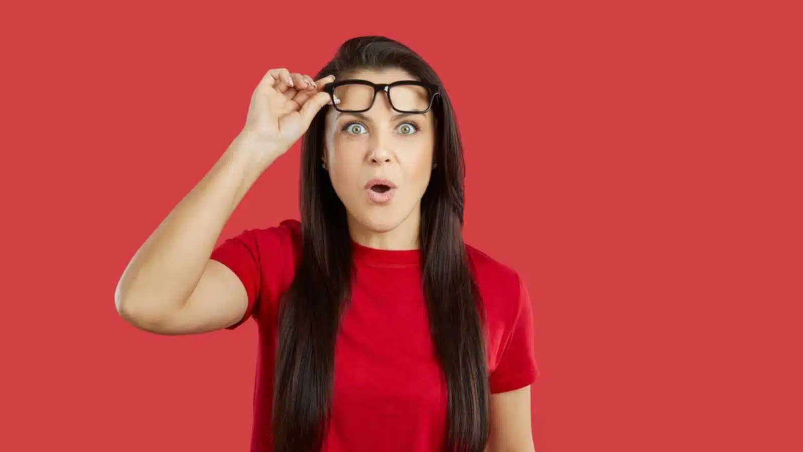 Woman shocked and removing specs