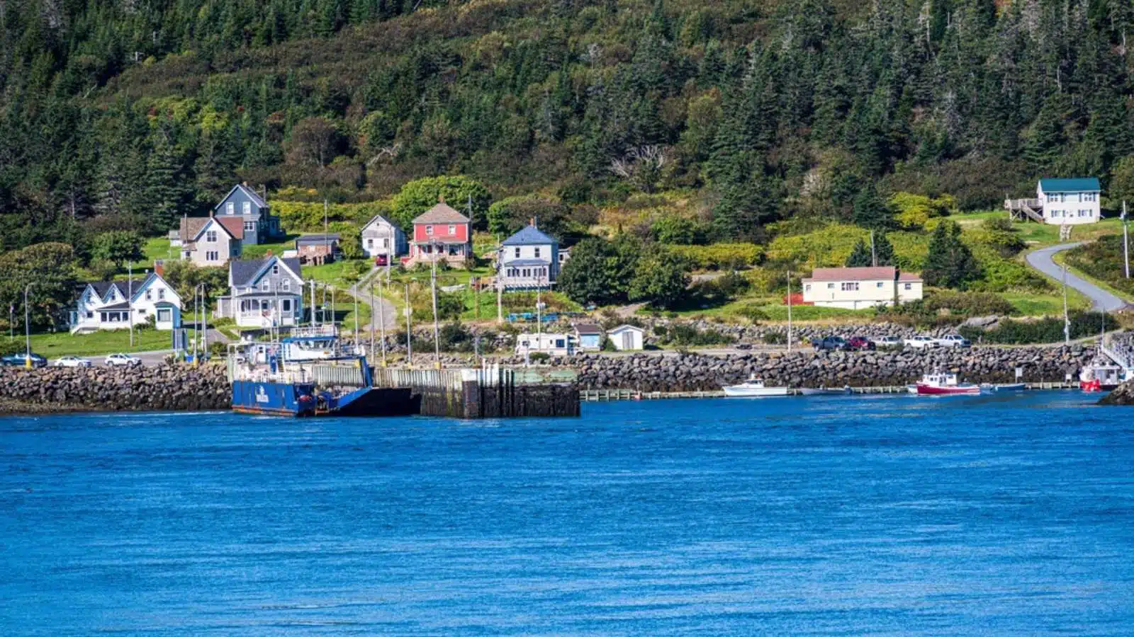 Briar Island, Nova Scotia, Canada -- Sept 19, 2022. A zoom shot of houses on the waterfront of Briar Island in Nova Scotia, Canada.