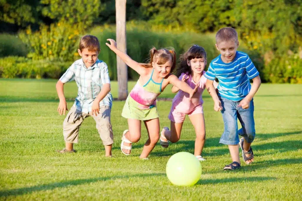 Kids kicking ball Depositphotos 5775056 XL