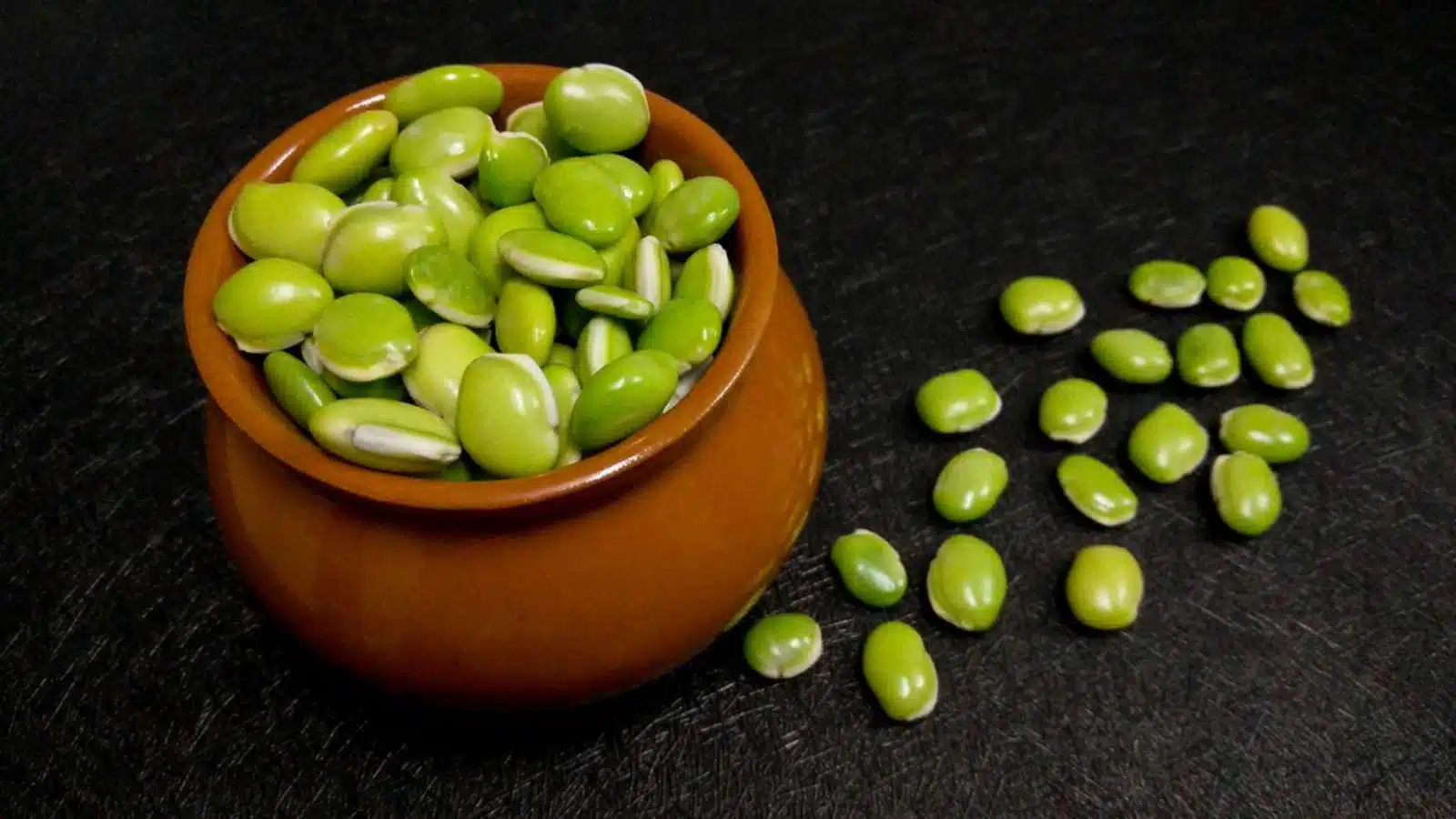 lima beans in the brown pot as food background