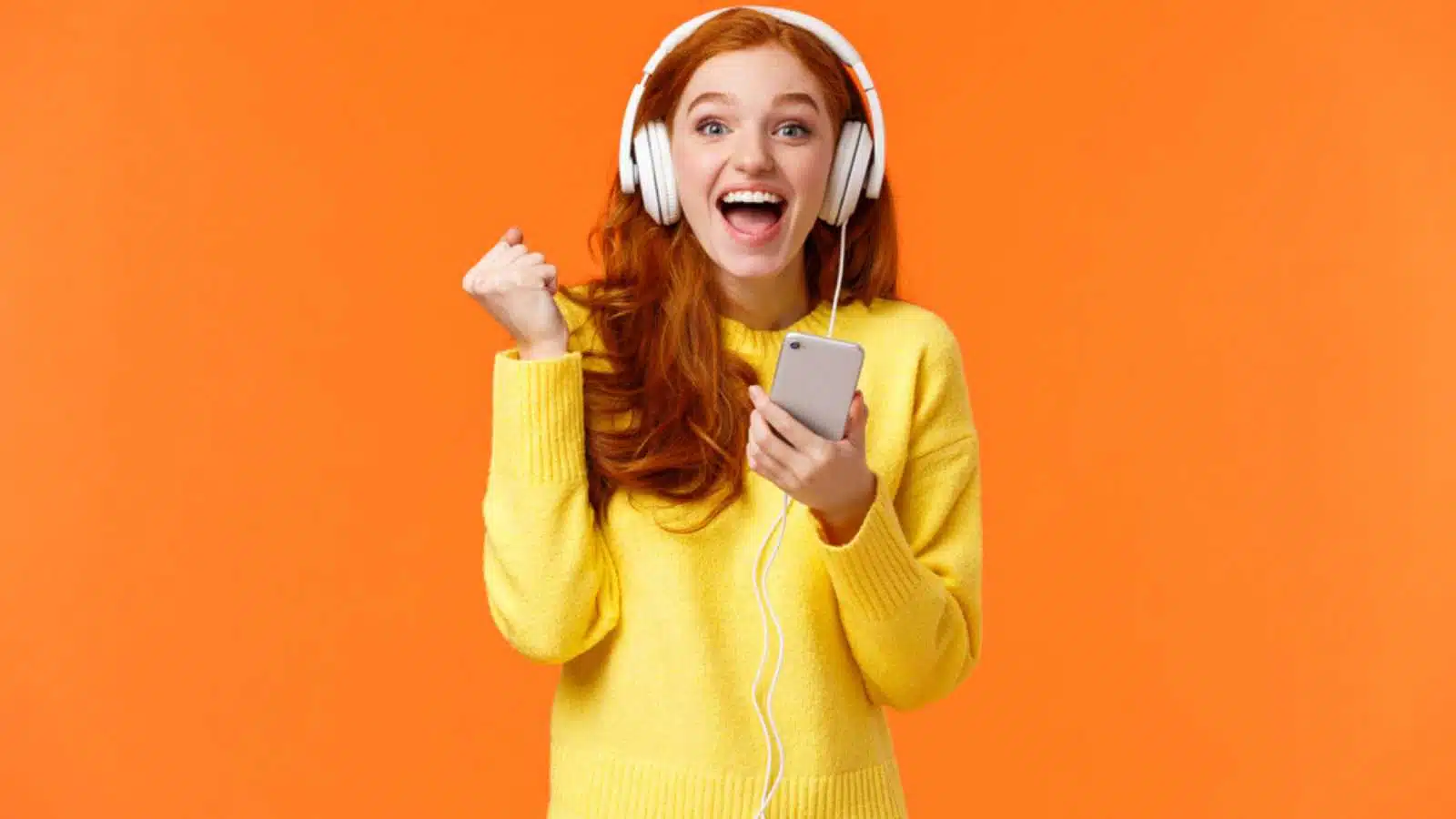 Attractive young woman listening to music