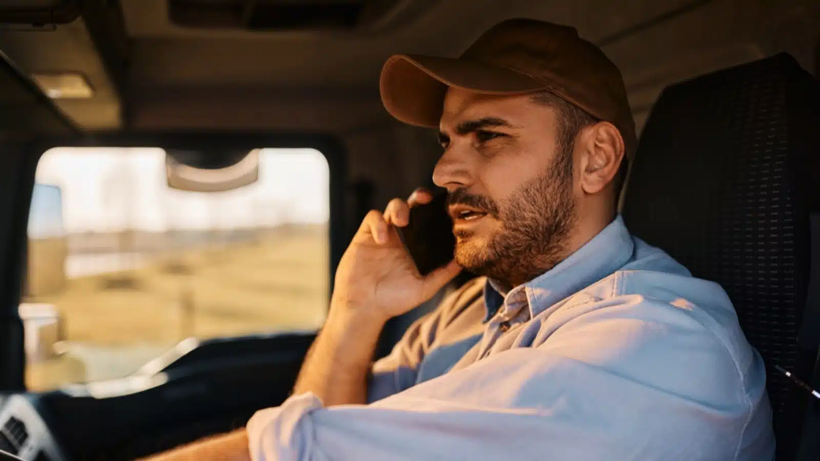 Delivery truck driver in phone