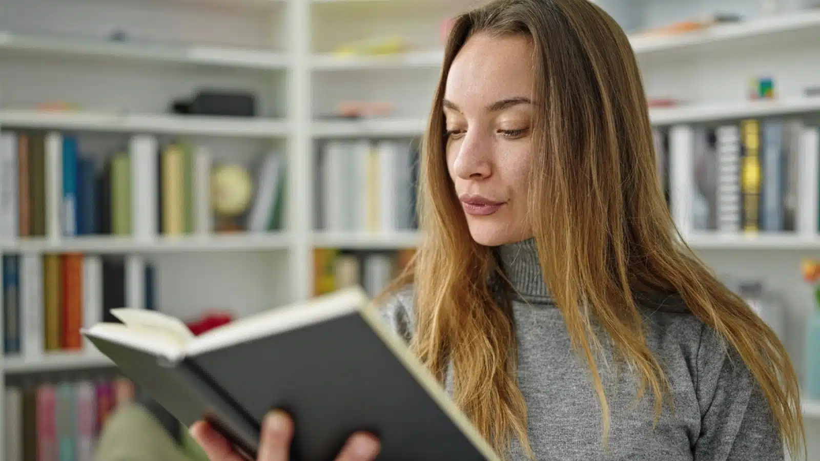 Woman reading book for knowledge