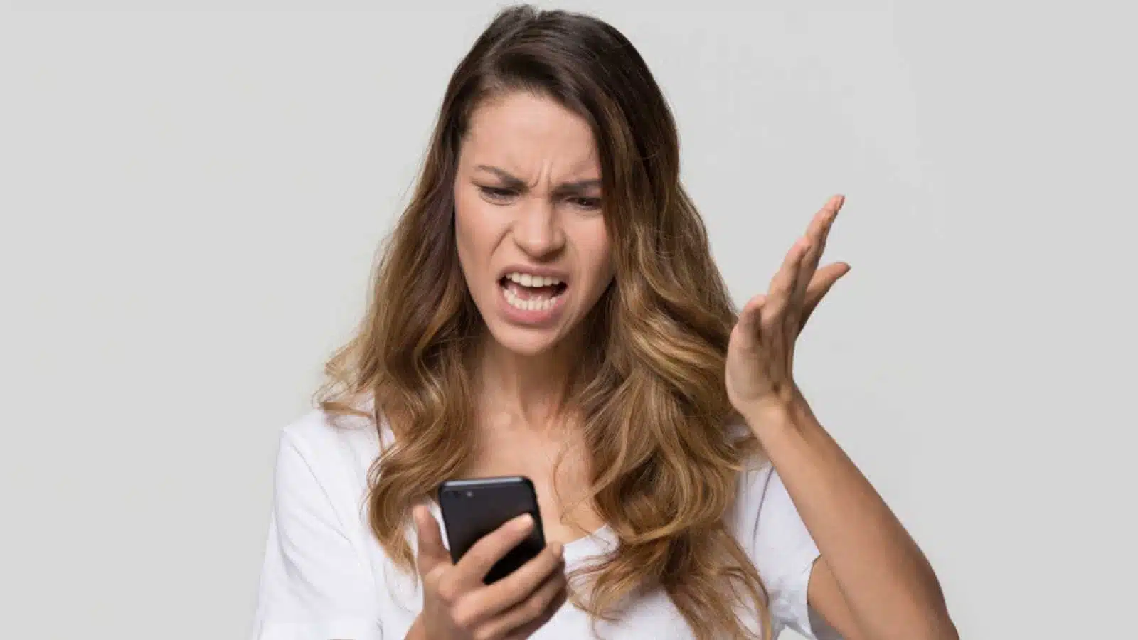 Annoyed woman with mobile