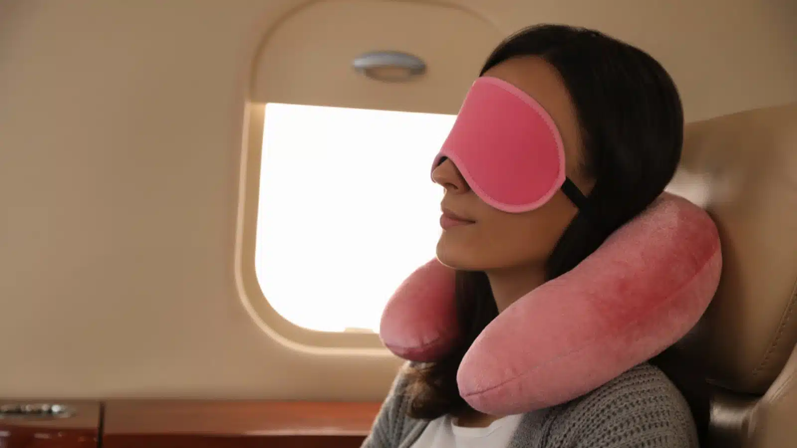 Sleeping with pillow and sleep mask in flight
