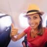 Woman taking selfie inside flight