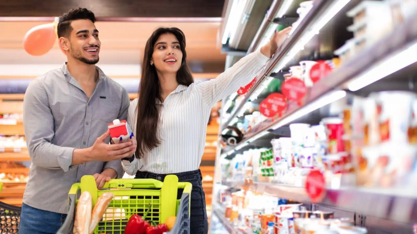Couples buying in grocery store