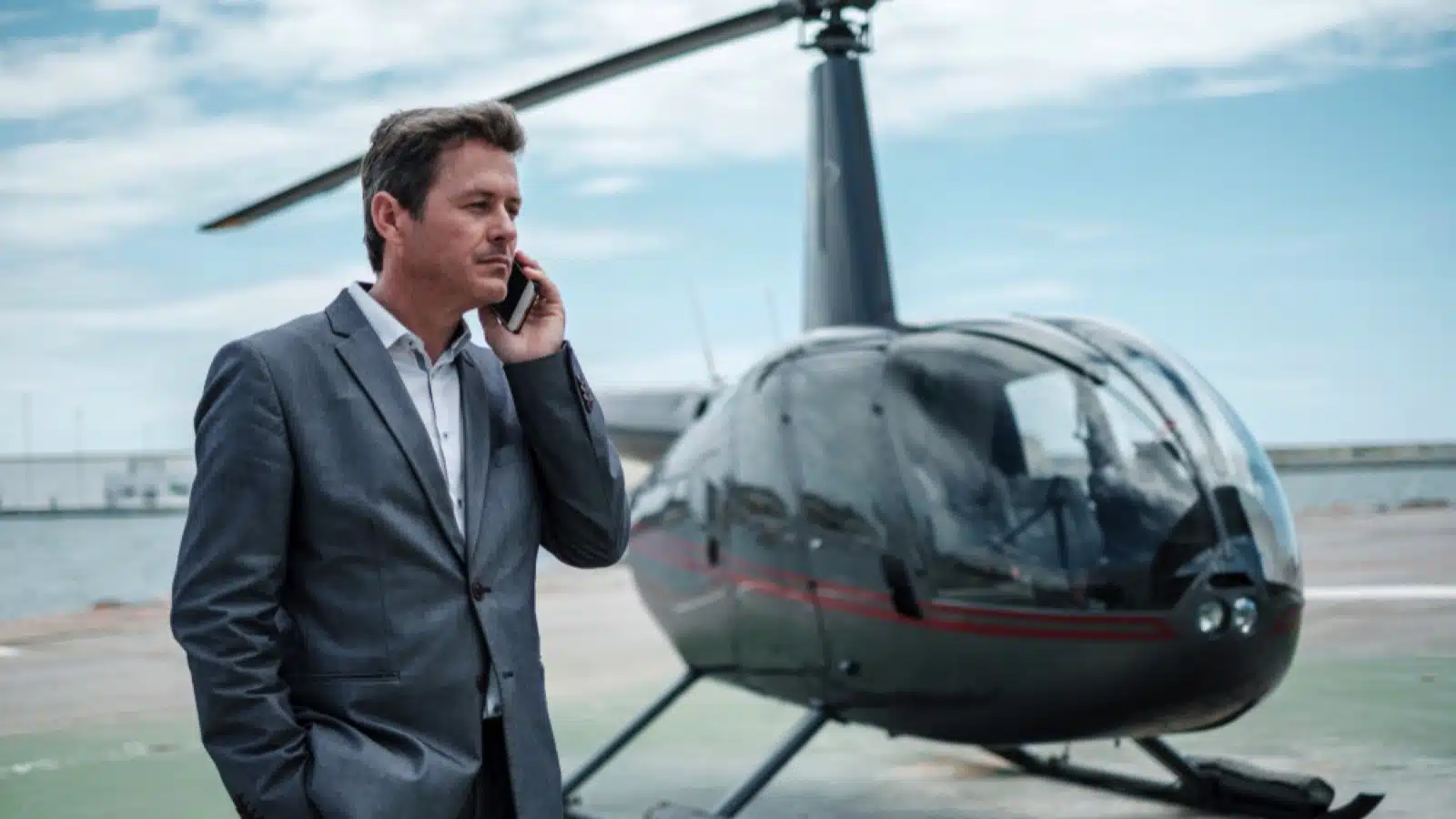 Businessman near helicopter