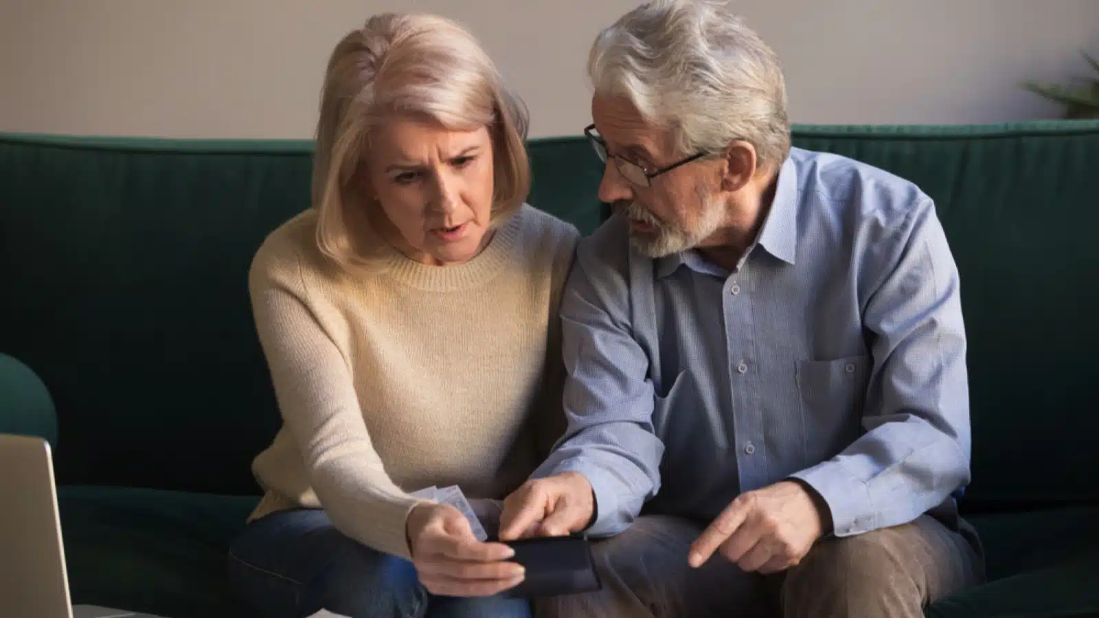 12 Things To Consider Before Moving Abroad After Retirement 15 Old couple discussing about debt