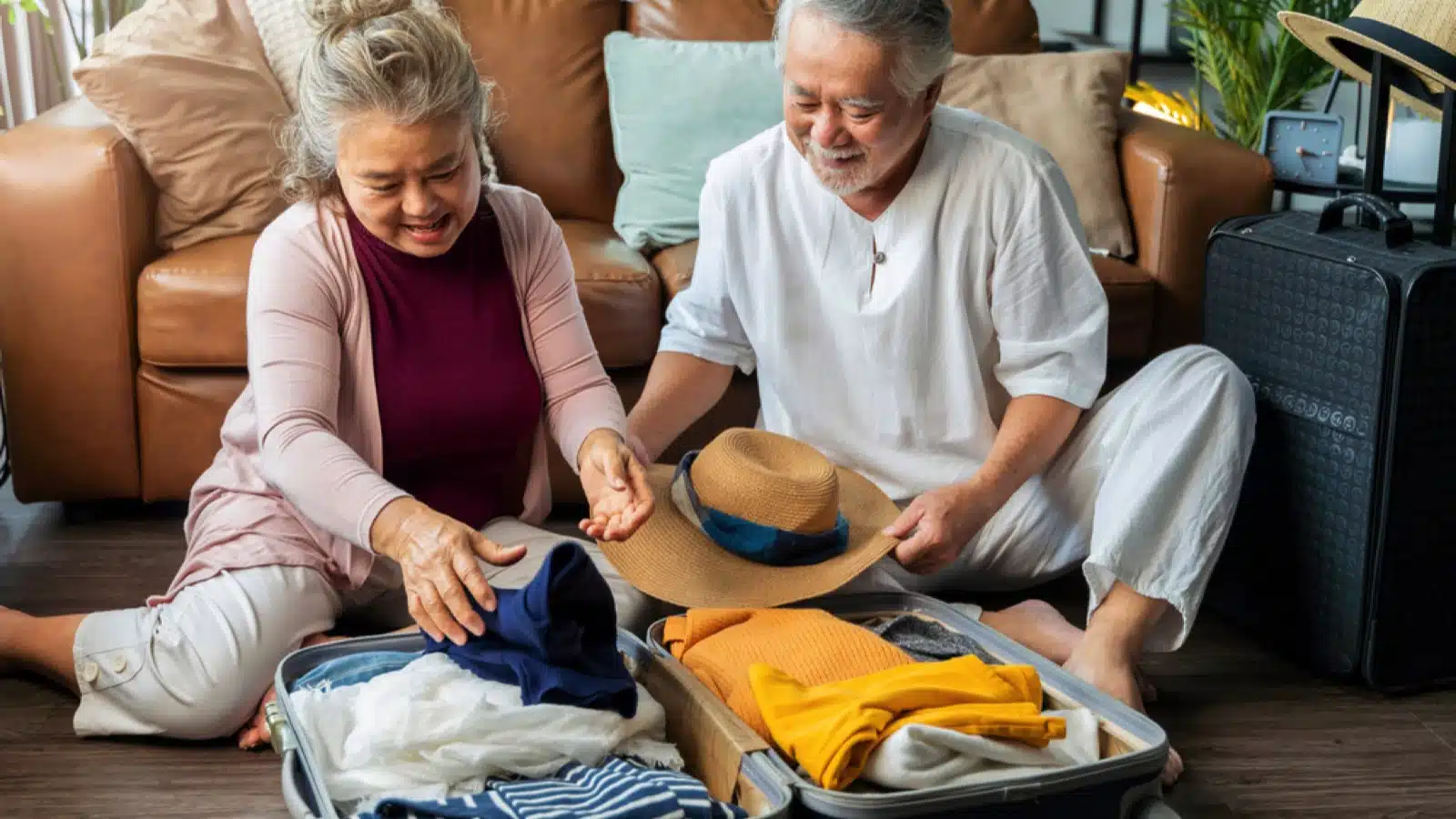 12 Things To Consider Before Moving Abroad After Retirement 7 Old couples packing suitcase